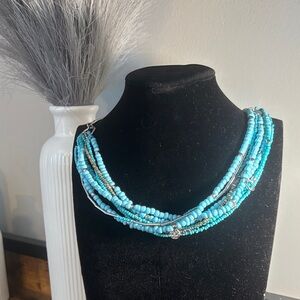 Turquoise and silver multiple strands necklace. Adjustable. New!